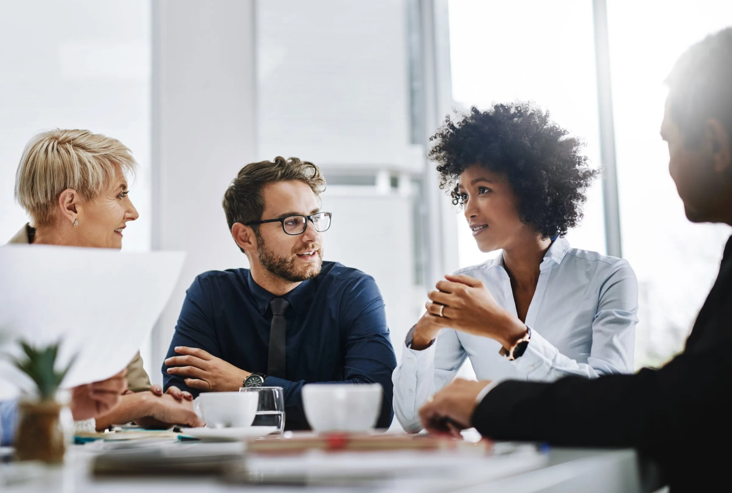 A team discussing work around a meeting table